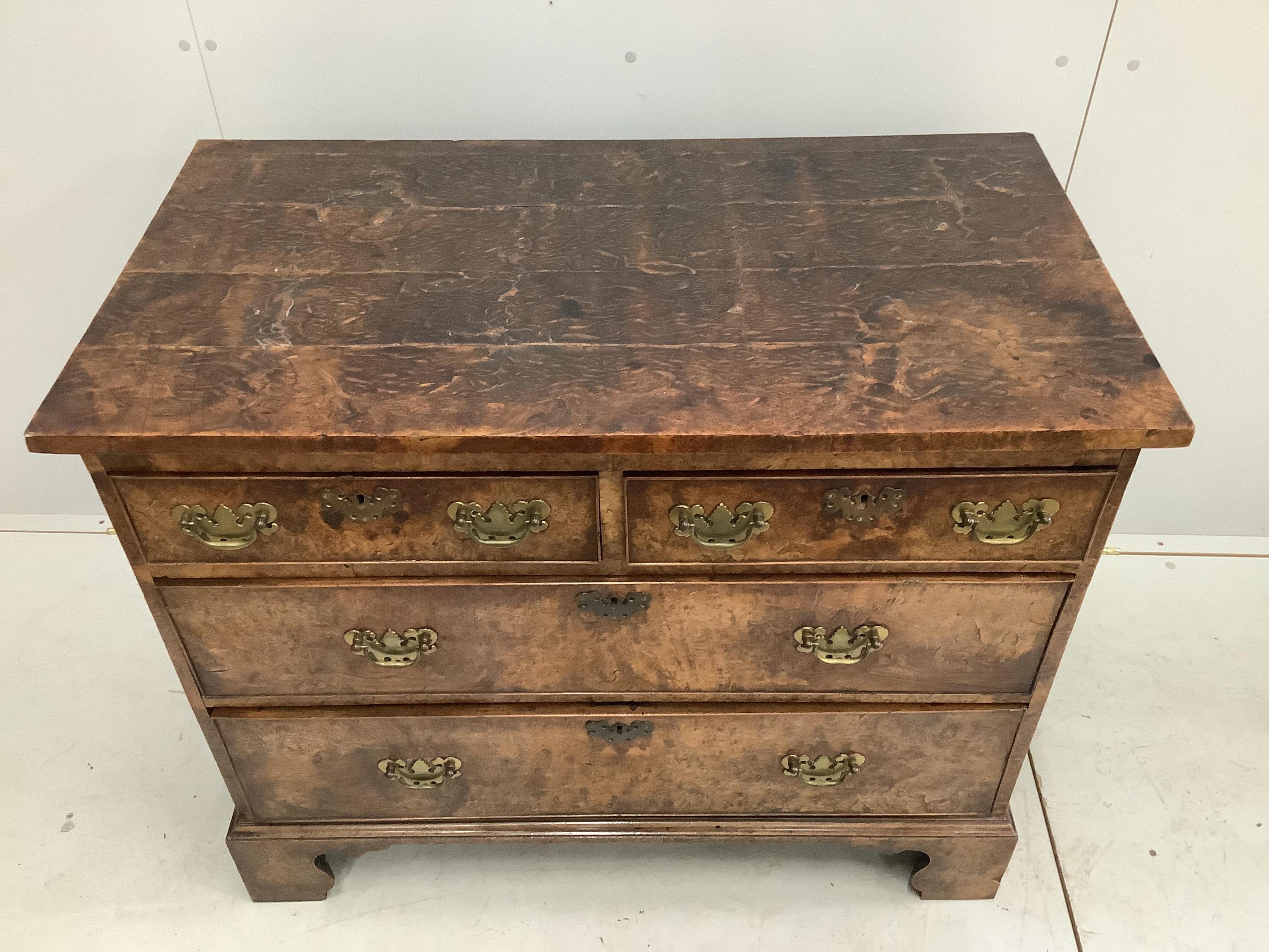 A George III burr elm chest of drawers, width 105cm, depth 57cm, height 86cm. Condition - fair